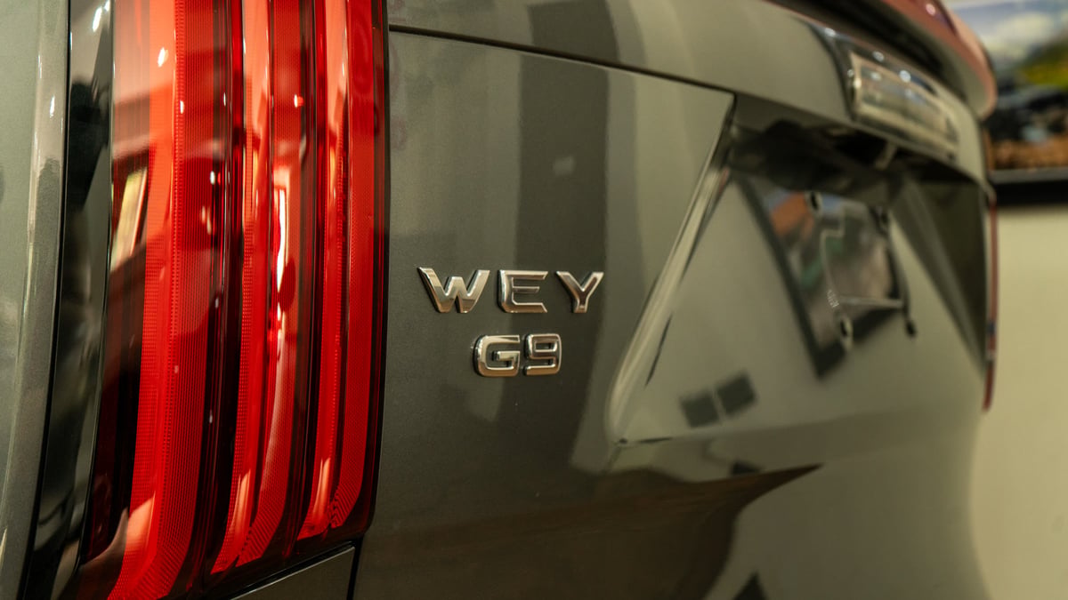The WEY G9 badge on the tailgate beside the full-width tail lamp