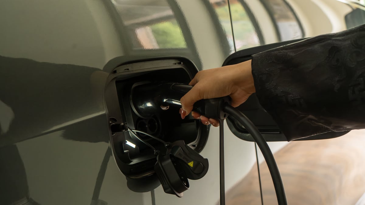 A charging cable being plugged into the ORA 5 charge port