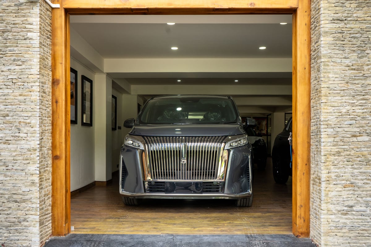 WEY G9 framed by the stone and timber showroom doorway