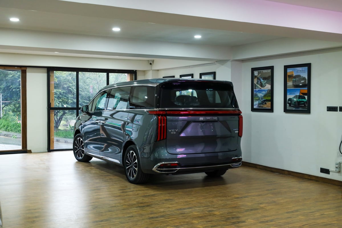 WEY G9 from the rear three-quarter on the showroom floor