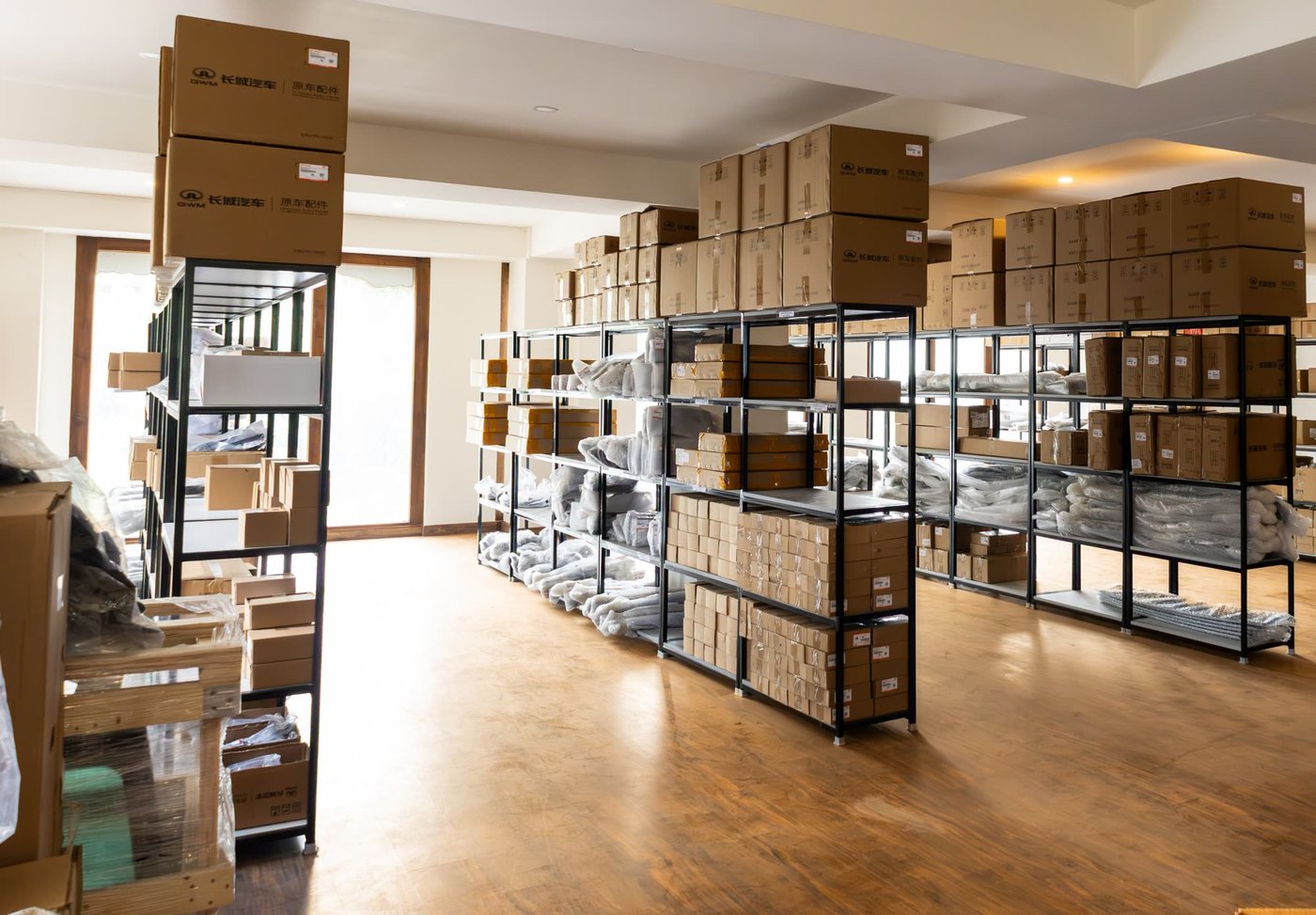Wide view of the in-country parts warehouse stocked with GWM components