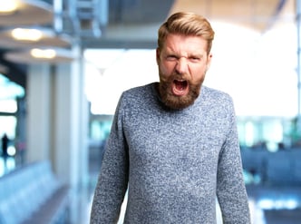 Angry expression on a blonde man