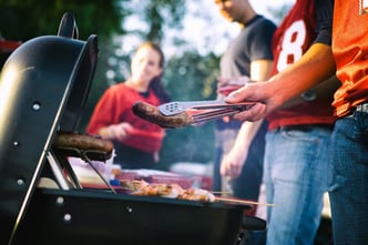 People getting ready to cook on a barbecue grill