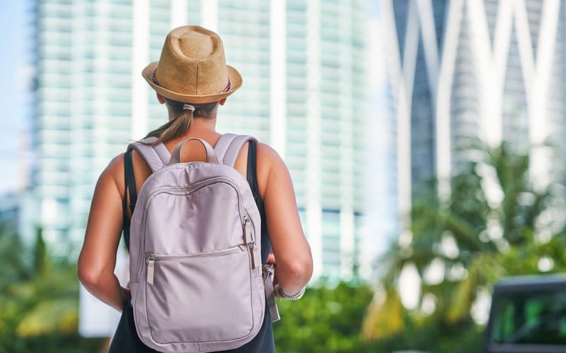 Snapshot of a tourist woman exploring the city’s skyscrapers in Miami