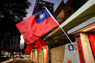 Taiwanese flags are installed along a street, in New Taipei city