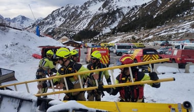 Firefighters work during a rescue operation following a chairlift accident in the Astun ski resort in Huesca