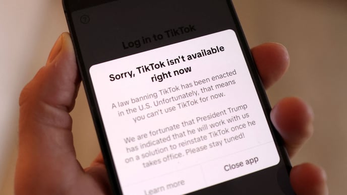 Illustration shows TikTok app with the message "Sorry, TikTok isn't available right now