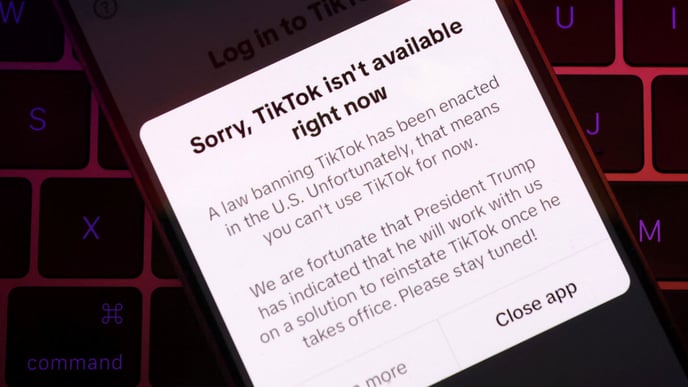 Illustration shows TikTok app with the message "Sorry, TikTok isn't available right now