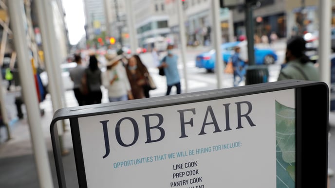 Signage for a job fair is seen on 5th Avenue after the release of the jobs report in Manhattan, New York City