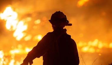 Firefighters and aircraft battle the Hughes Fire near Santa Clarita