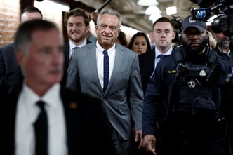 RFK Jr., walks through the Russell Senate Office Building between meetings with senators on Capitol Hill in Washington