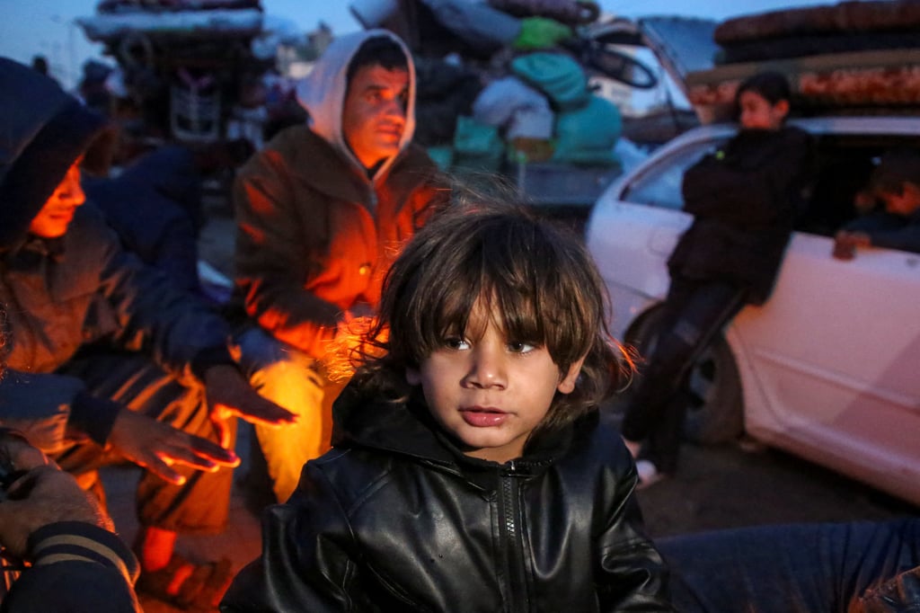 Displaced Palestinians wait to be allowed to return to their homes in northern Gaza, in the central Gaza Strip