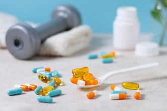 Arrangement of pills alongside a spoon