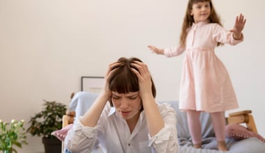 Medium shot of a woman experiencing a headache