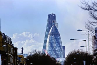 View of London buildings from a low angle, set against the sky