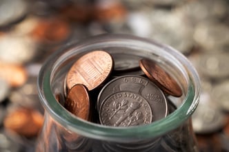 Close up on coins in jar