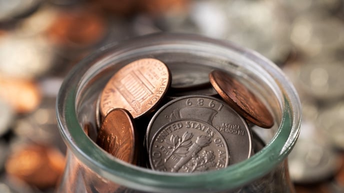 Close up on coins in jar