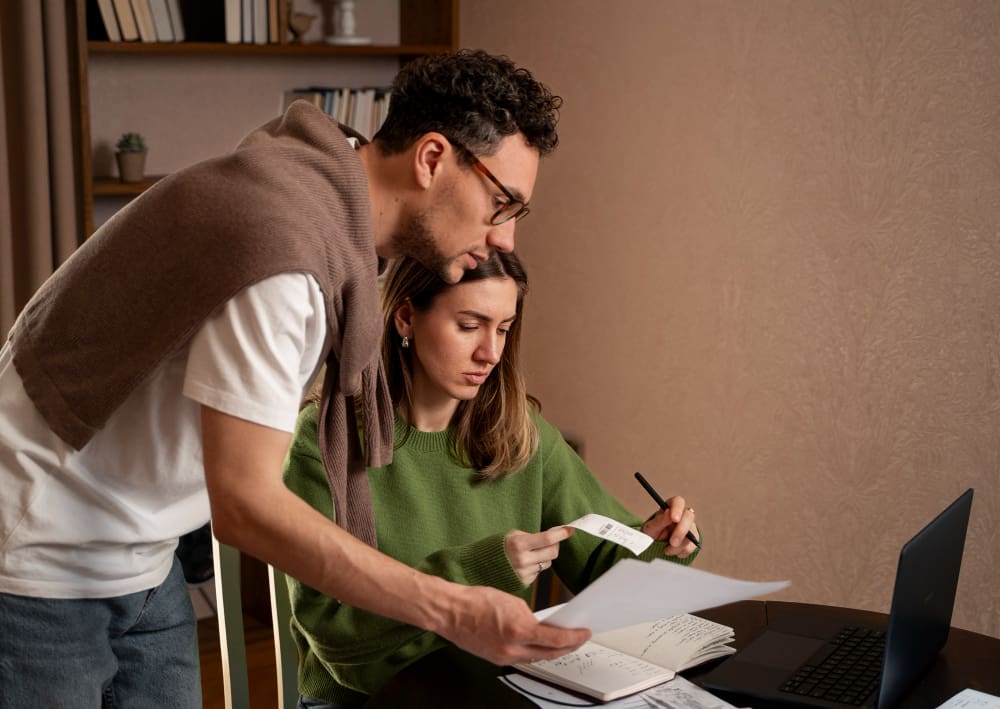 A couple feeling stressed about their financial challenges and tax obligations