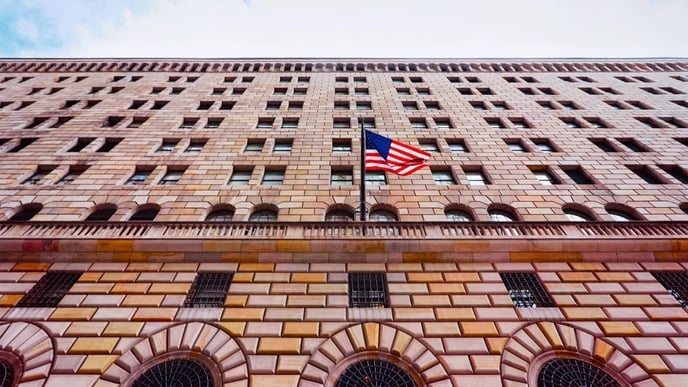 A street-level perspective of the Federal Reserve Bank of New York building, located in the Financial District of Lower Manhattan, New York City