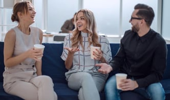 A trio of friends is engaged in a thoughtful discussion, demonstrating a remarkable ability for empathy and active listening