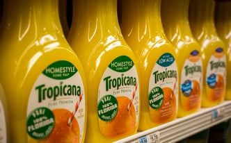 Bottles of Tropicana orange juice are seen in a supermarket refrigerator case