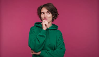 Front view of a young woman gazing thoughtfully