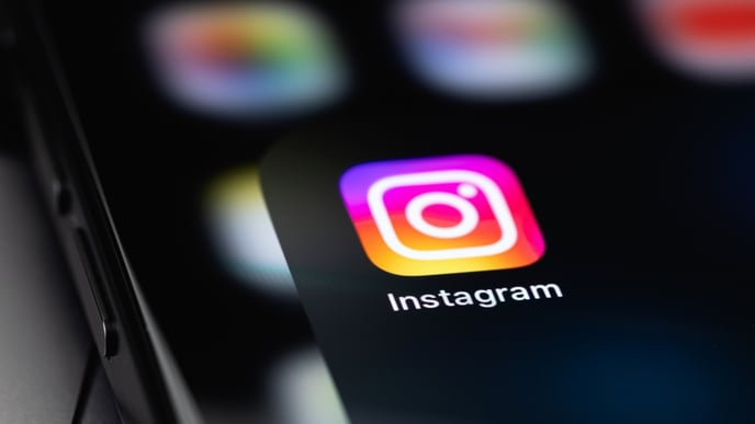 Instagram icon mobile app on a screen smartphone iPhone closeup Instagram is a photo-sharing app for smartphones