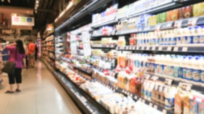 Long refrigerator filled with food at a supermarket