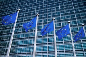 European flags in front of the Berlaymont building in Brussels, Belgium.