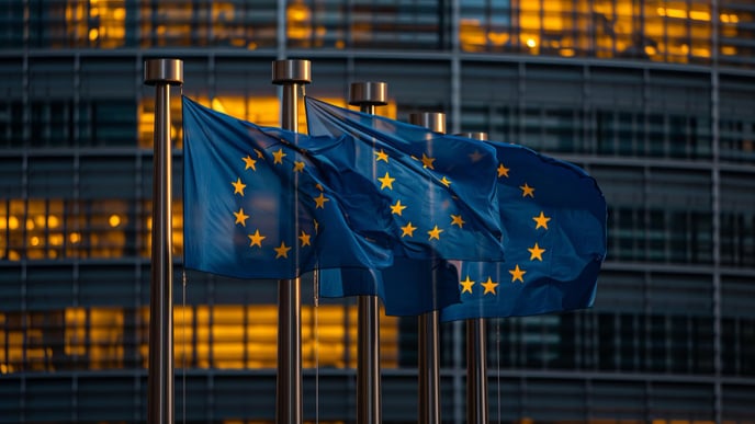 European union flags waving in front of european parliament building