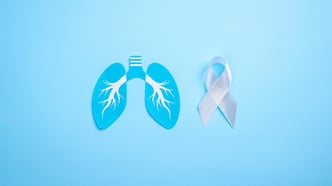 Lung cancer emblem crafted from paper featuring a white ribbon