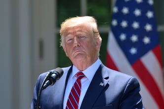 President Donald Trump emerges from a meeting with Senate Republicans