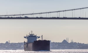 Tanker ship pass through the Bosporus with Bosphorus Bridge in Istanbul Turkey