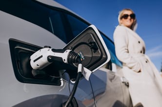 Woman charging electro car