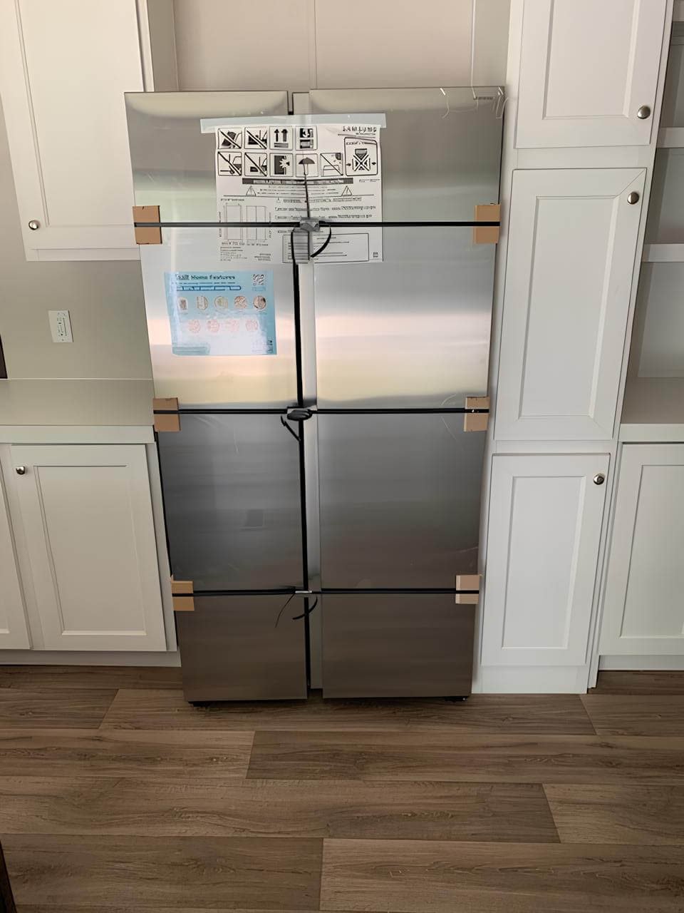 Four-door stainless refrigerator in The Colossal Ultrawide kitchen