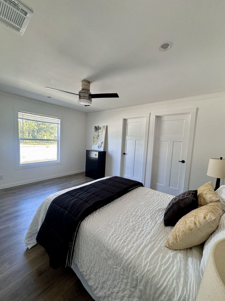 Spacious primary bedroom in The Cami mobile home for sale near Conroe, Texas