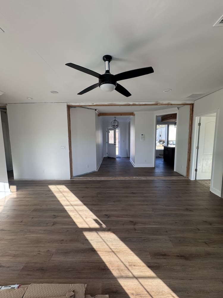 Open dining area with ceiling fan in The Shoreline double-wide home