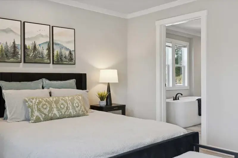 Primary bedroom opening into the private bathroom in The Carol 4-bedroom model