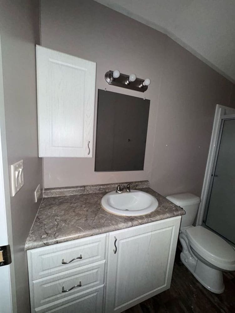 Bathroom vanity and storage inside The Leyla traila en venta in Conroe, Texas