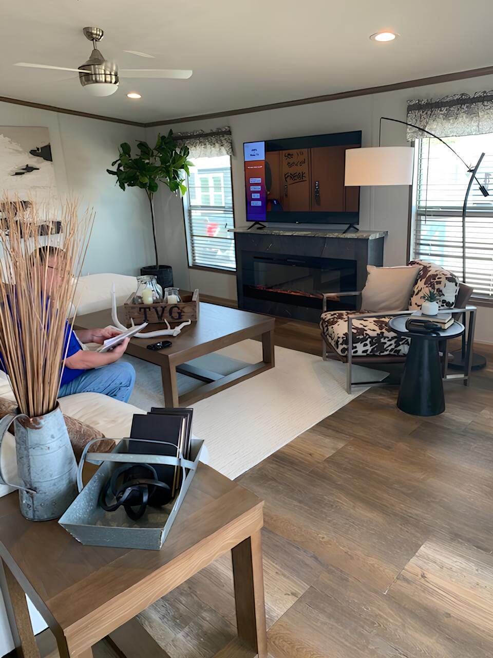 Living room with fireplace in The Lakehouse H-3264-32AP manufactured home