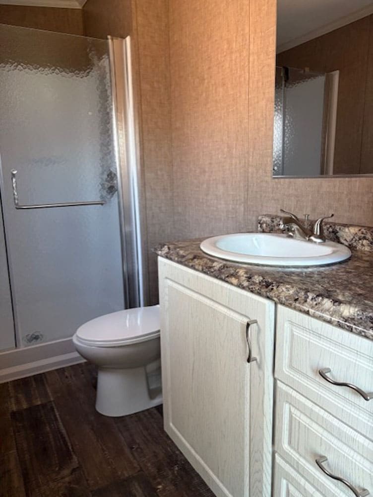 Guest bathroom with walk-in shower in The Leslie traila en venta