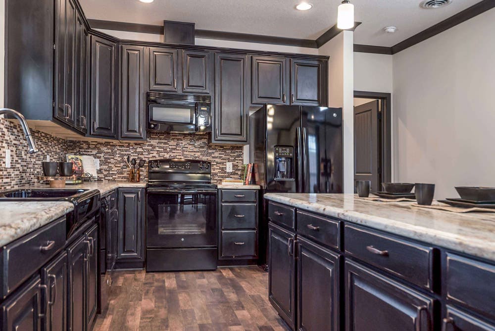 Black appliances and abundant cabinetry in The Nandina kitchen