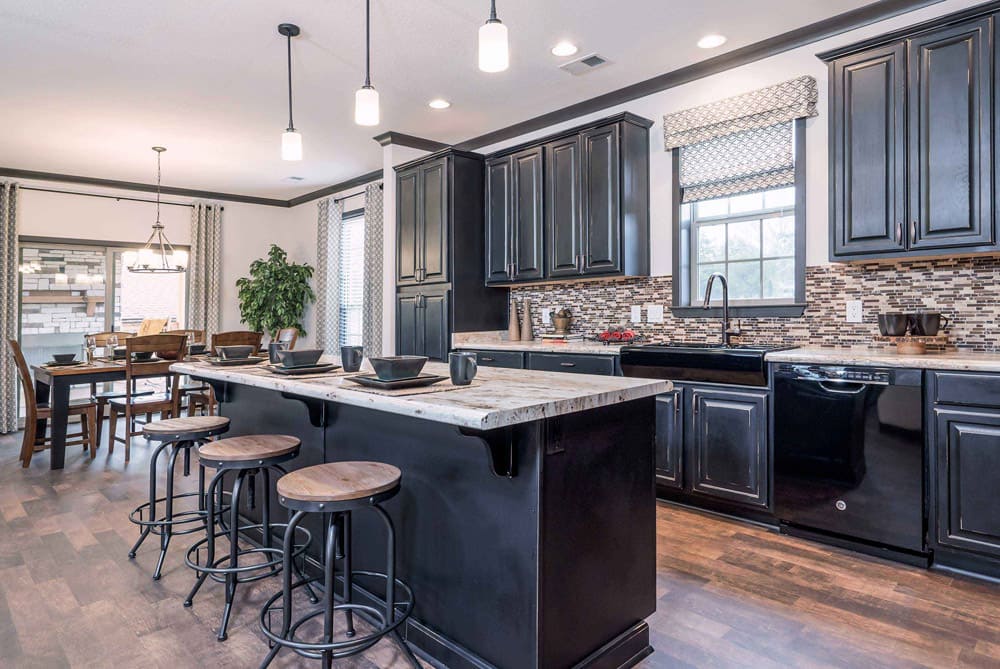 Open-concept kitchen with breakfast island in The Nandina 3-bedroom modular home