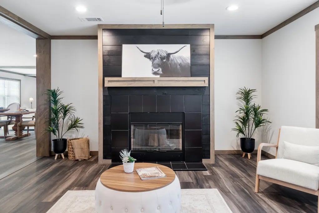 Black tile fireplace centerpiece in the Isabella Elite manufactured home
