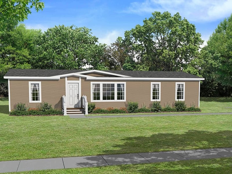 The Odyssey XL 3256 by Champion Homes exterior with long front porch and broad windows