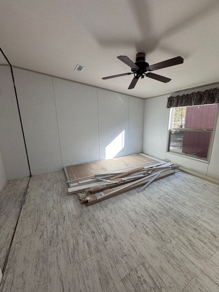 Secondary bedroom with ceiling fan in The Lucia manufactured home