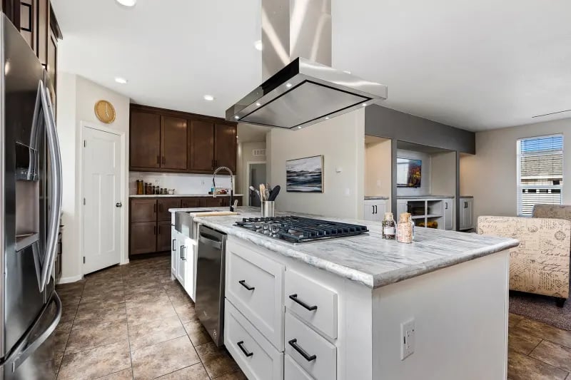 Kitchen island in The Odyssey XL 3256 manufactured home