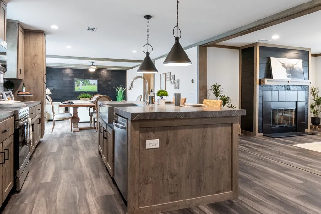 Large kitchen island overlooking the dining room and fireplace