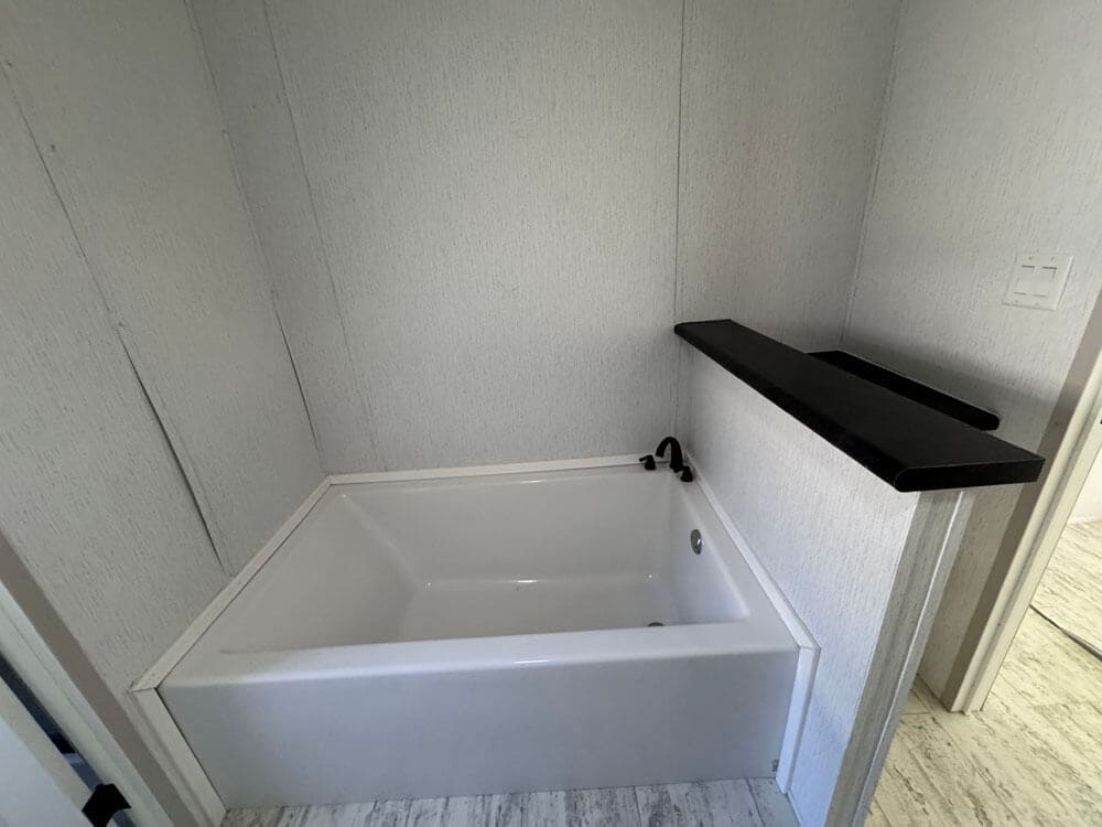 Large soaking tub in The Lucia 1568 square foot manufactured home