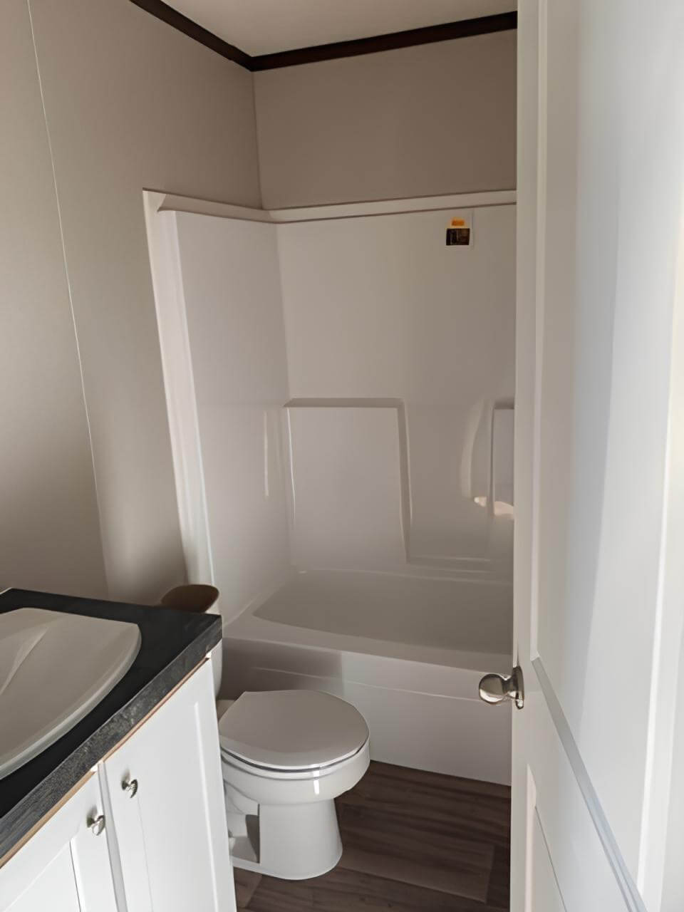 Guest bathroom with tub in The Spirit manufactured home